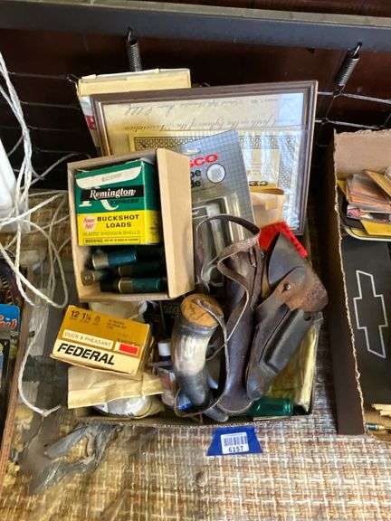 Gun cleaning supplies, shotgun shells, powder horn, holsters, hunting book