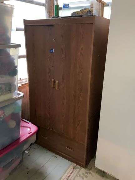 Cabinet and contents: various Monopoly games, other games, cloth bags - no top contents  33x64x24