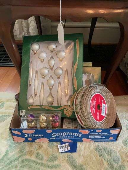 Boxed sets of Christmas ornaments, roll of ribbon