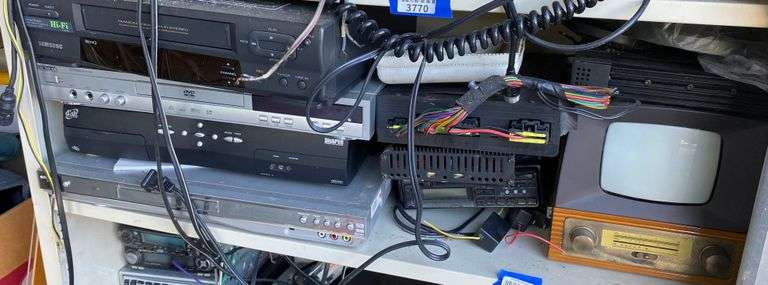 Contents of shelf: VCR, DVD player, Dish satellite receiver, DVD player, vintage TV, electronics