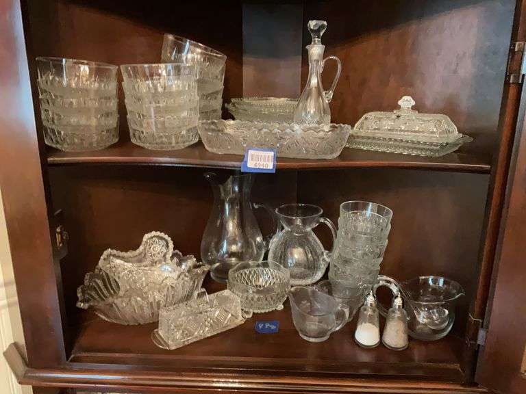 Contents of two shelves: various pressed glass bowls and serving pcs, engraved and crackle glass pitchers