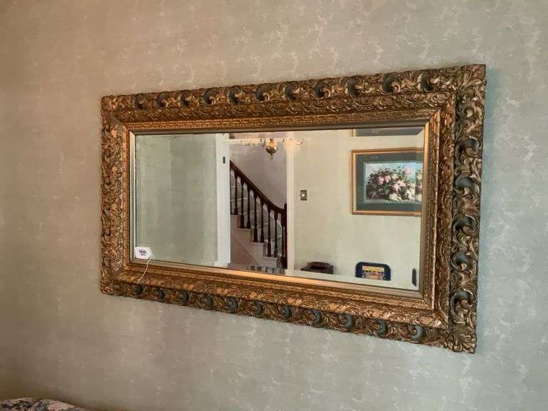 Beveled mirror in pierced gilt frame 29x51