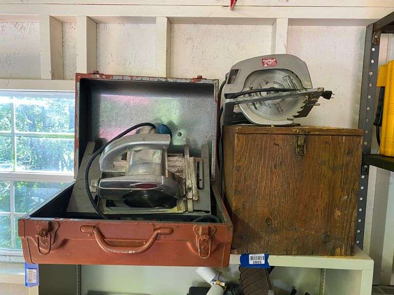 Contents of shelf: Craftsman circular saw in case, ShopCraft circular saw, wooden case