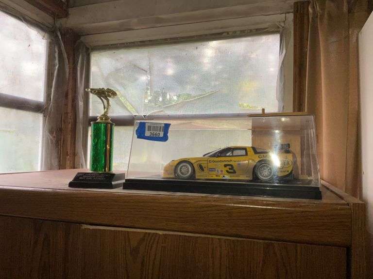 Nascar Goodwrench car model in case, and 2017 Tuscarora District derby trophy