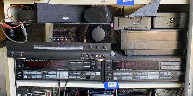 Contents of shelf: stereo receivers, speakers