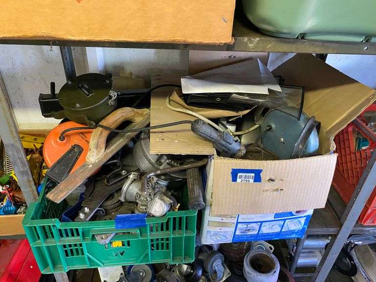 Contents of shelf: trowel, trouble light, misc lot