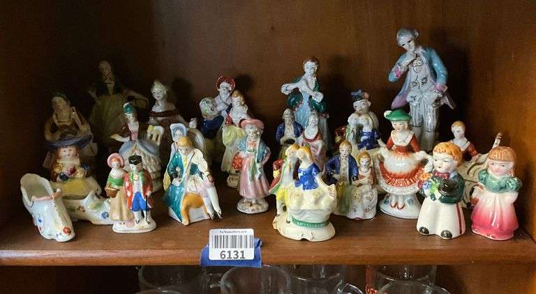 Contents of shelf: figurines including Occupied Japan, figural salt/pepper shaker pair, china shoe