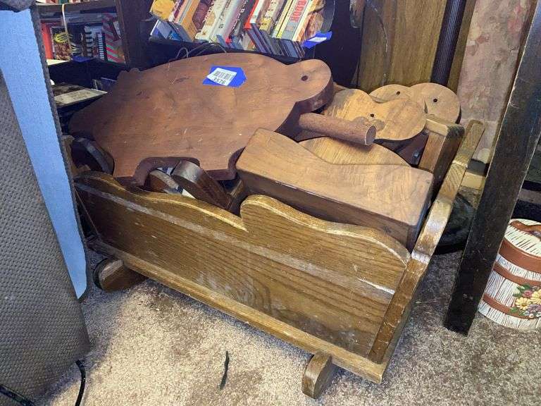 Wooden cradle and handcrafted woodenware contents