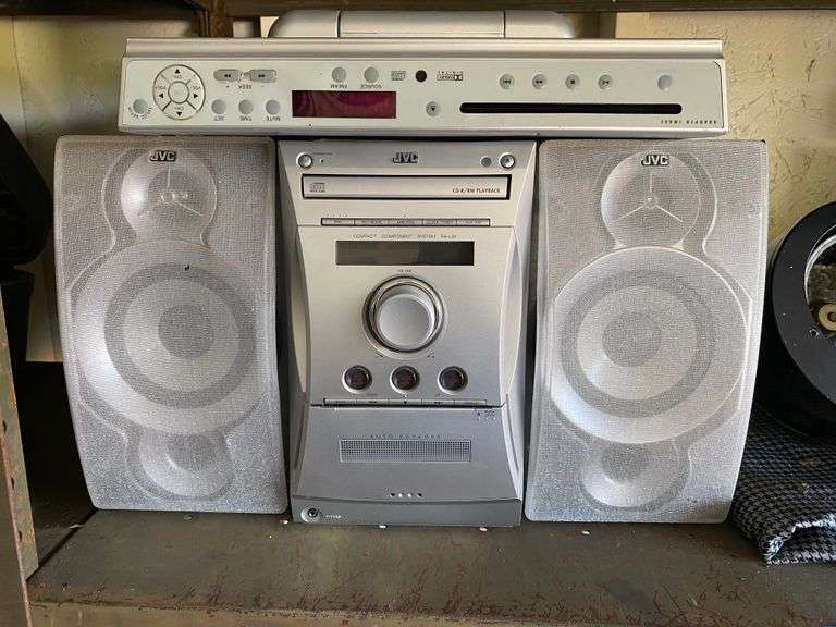 Contents of shelf: JVC CD stereo, under cabinet CD player/radio, air blower, misc