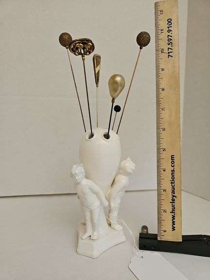 Porcelain figurial hat pin holder w/ six hat pins