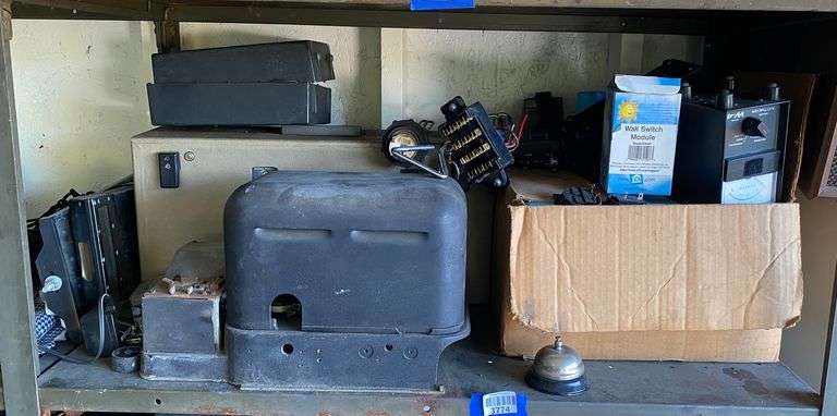 Contents of shelf: electronics including Teletype machine, Wollensak 3M reel-to-reel tape player, misc