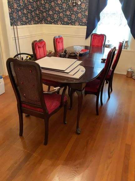 Queen Anne dining table w/ cabriole legs, extra leaves and table pads, along with set of six chairs w/ caned backs and velvet seats/back cushions - no contents 84x42x30