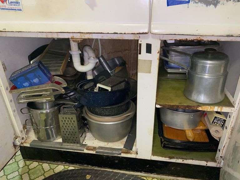 Contents of cupboard: cookware, baking pans, kitchenware, rolling pin