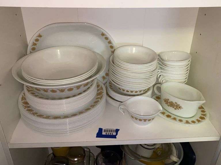 Contents of shelf: vintage Corelle Butterfly Gold dinnerware