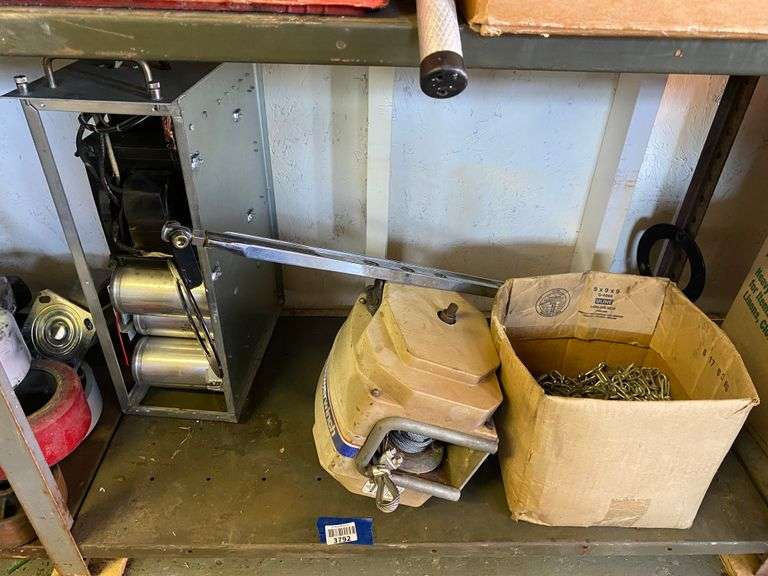 Contents of shelf: power winch, chain, misc