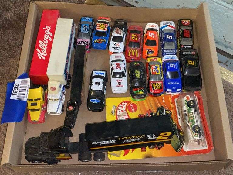 Model race cars and transport trucks