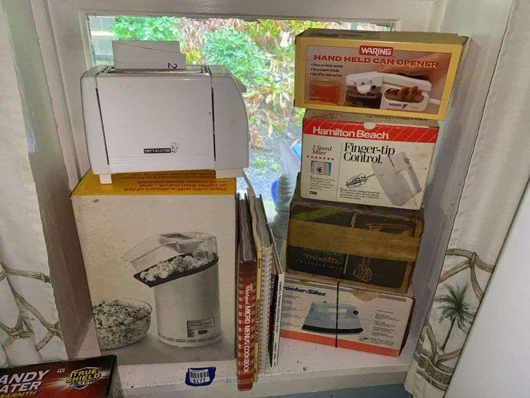 Small appliances: toaster, popcorn popper, can opener, hand mixers, iron, cookbooks