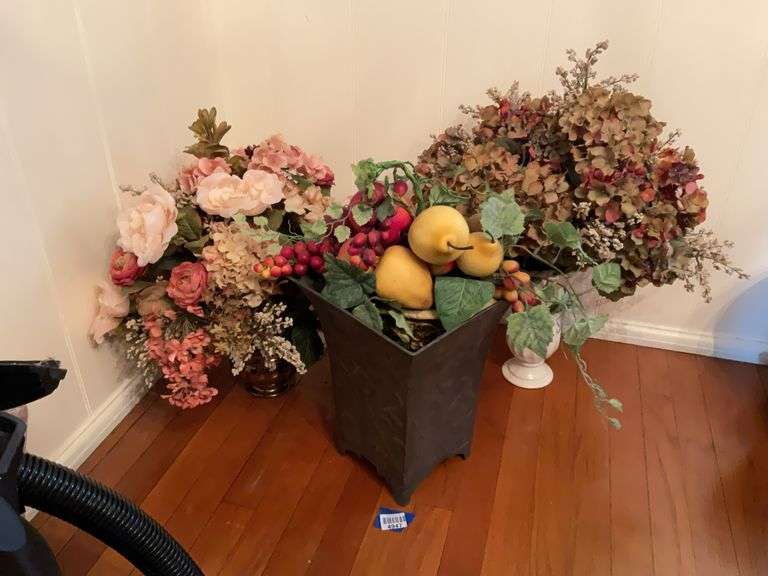 Faux fruit and floral arrangements