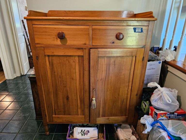 Country jelly cupboard, w/ gallery rail, two drawers over two doors, turned legs, no contents (from the home of Charles B Carl of Greencastle 52 in h, 39 in w, 19 in d, MUST COME DURING LAST 2 HOURS OF PICK UP FOR THIS ITEM