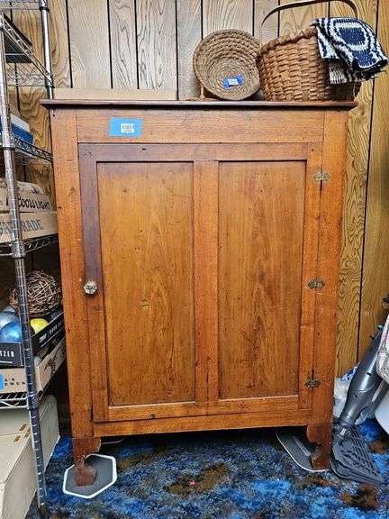 Country jelly cupboard w/ rear gallery board, single double paneled door, sawn feet, no contents 51 in h, 36 in w, 14 in d, MUST COME DURING LAST 2 HOURS OF PICK UP FOR THIS ITEM