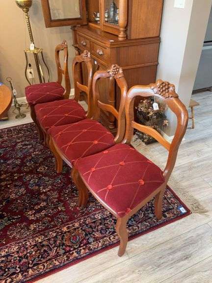 Set of four Rococo Revival side chairs with carved grape crests and  upholstered seats