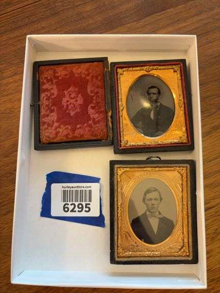 Two Victorian photograph cases with Civil War theme mats, "The Union Now and Forever" with US flags and cannons