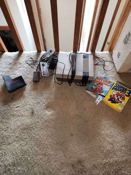 Nintendo and two Mario games, two controllers