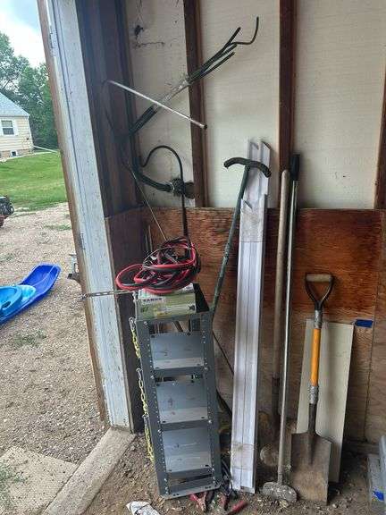 Contents of Items in the Corner - Spades, Jumper Cables, Metal Rack, TV Mount, & More