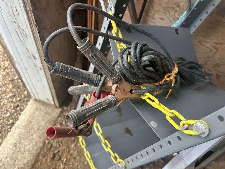 Contents of Items in the Corner - Spades, Jumper Cables, Metal Rack, TV Mount, & More