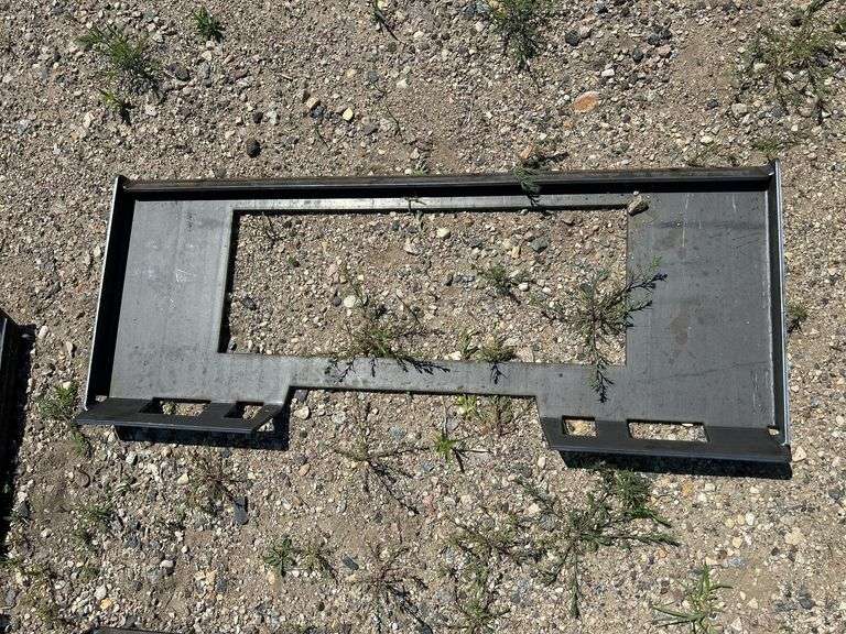 Open center skid steer plate