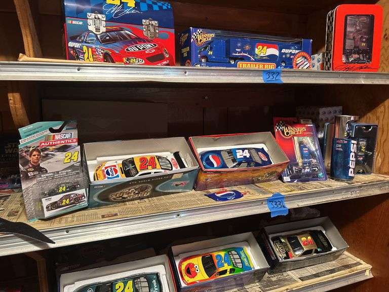 Two Shelves of Jeff Gordon Collectible Cars