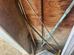 Contents of Items in the Corner - Spades, Jumper Cables, Metal Rack, TV Mount, & More