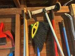 Items on The Wall - 6 Ft Level, Brooms, Dust Pans, Receiver Hitch, & More