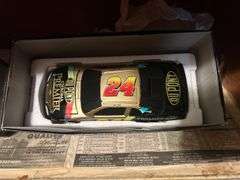 Two Shelves of Jeff Gordon Collectible Cars