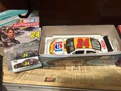 Two Shelves of Jeff Gordon Collectible Cars