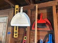 Items on The Wall - 6 Ft Level, Brooms, Dust Pans, Receiver Hitch, & More