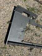 Open center skid steer plate