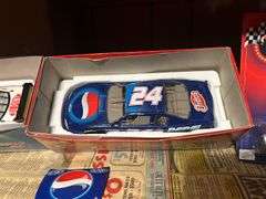 Two Shelves of Jeff Gordon Collectible Cars