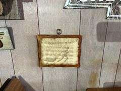 Group of Wall Hangings - Metal Signs, Hoofed Gun Holder, and More Decor