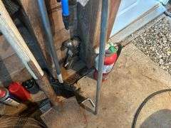 Items on The Wall - 6 Ft Level, Brooms, Dust Pans, Receiver Hitch, & More
