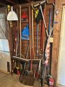 Items on The Wall - 6 Ft Level, Brooms, Dust Pans, Receiver Hitch, & More