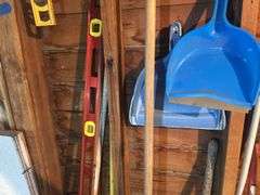 Items on The Wall - 6 Ft Level, Brooms, Dust Pans, Receiver Hitch, & More
