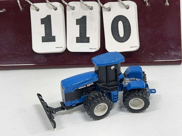 1/64 Scale  1998  ERTL  New Holland 9682 with Dozer KFYR Agri-International Show Tractor