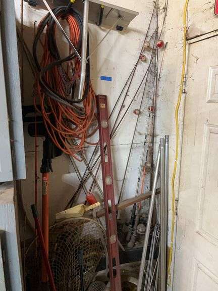 Roof Rake, Pole Saw, Fishing Poles & Contents in Corner.