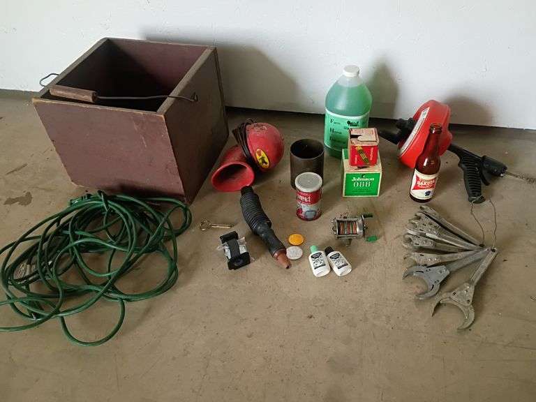 Egg box, extension cord, JOAR wrenches, drain snake, hand cleaner, brass scale bucket, duck call, more