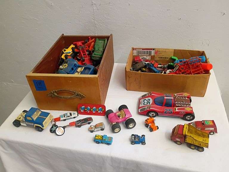 Toy vehicles and other toys