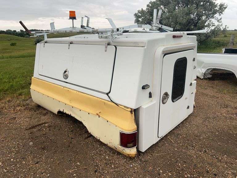 Utility Truck Bed Cap with Storage Compartments & Roof Rack in a Square Body Chevy Box