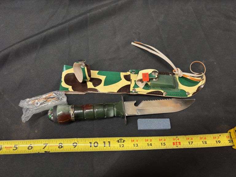 STAINLESS STEEL CAMOUFLAGED SURVIVOR KNIFE WITH COMPASS, FISHING LINE, MATCHES, AND SHARPENER