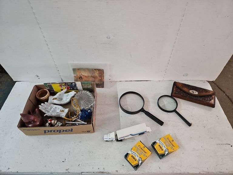 MAGNIFYING GLASSES, WALLET, CHALK, POSTCARDS, WIND CHINE, HANDS, ETC.