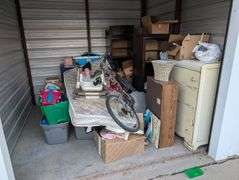 STORAGE UNIT #210 (10X10) (BUYING IN ENTIRETY) (MUST BE VACANT BY 08/03/24 AT 4:00 P.M.!)